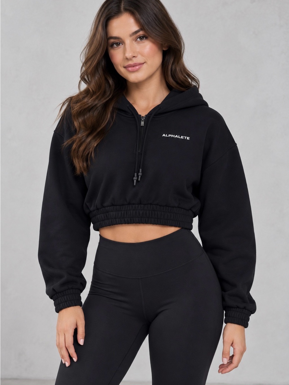 Alphalete women’s black cropped hoodie in size Medium.